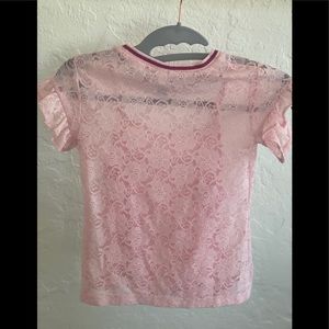 A pink lace top for girls, with pink tank top attached under.